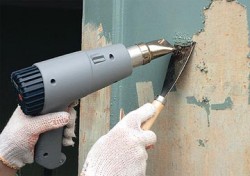 removing old paint with a building hairdryer